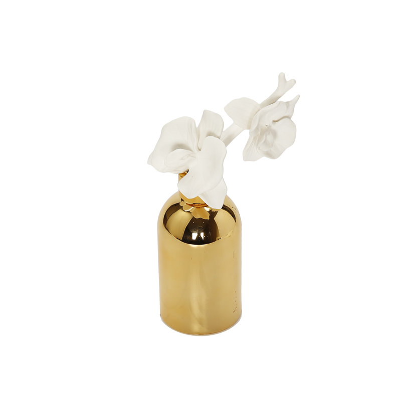 Diffuseur de bouteille d'or avec bouchon doré et fleur blanche, "English Pear & Freesia"