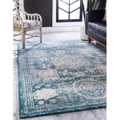 Tapis turquoise à motif géométrique Rizo