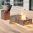 48" Propane Gas Fire Pit Table 50,000 Btu Featuring Hollowed Out Milu Deer Patterns And Golden Light