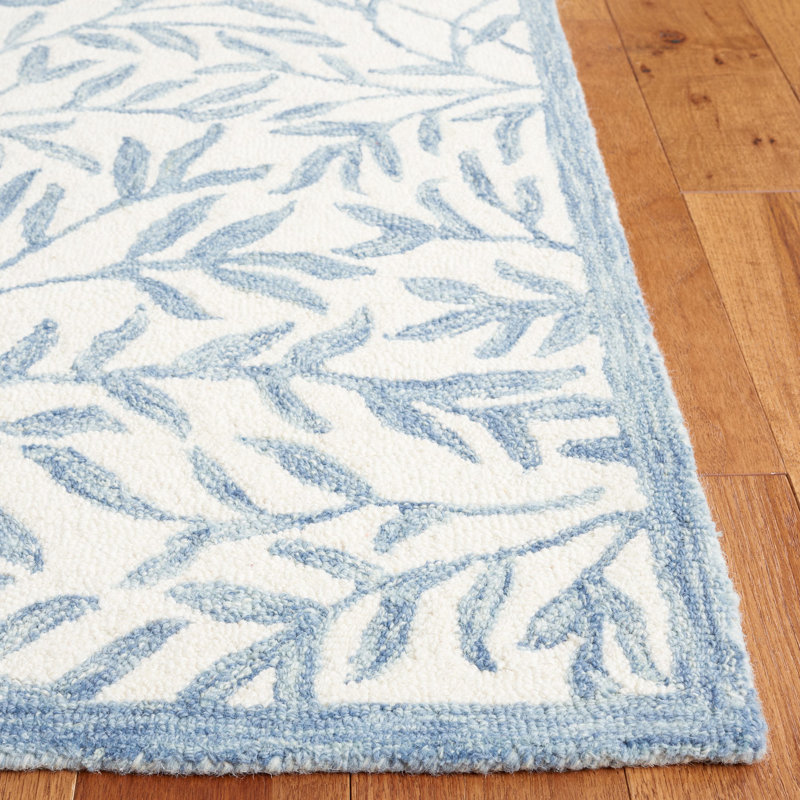 Iqarar Hand Tufted Wool/Cotton Floral Rug in Blue/Ivory, Rectangle 5' x 8'