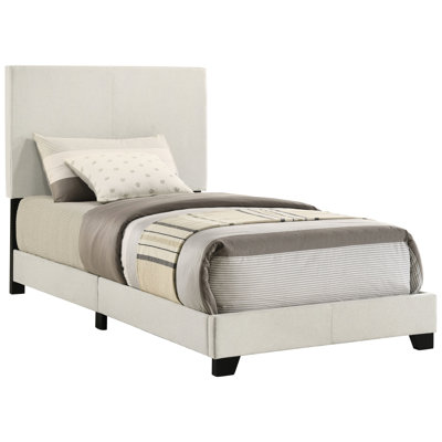 Twin Panel Bed In Cream Upholstery, Padded Headboard For A Relaxed Atmosphere, Rubberwood And Engineered Wood Composition, Black Solid Legs, Bedroom Centerpiece, Transitional Style, Box Spring