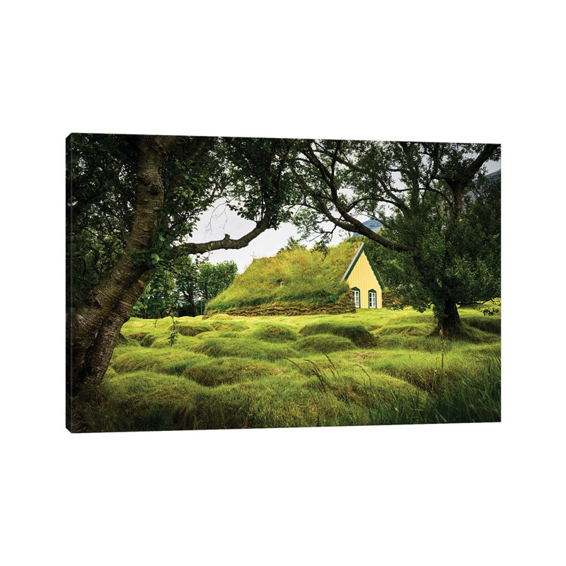 Iceland, Turf-Roofed Hof Church And Surrounding Grave Mounds. by Mark Williford - Wrapped Canvas Print