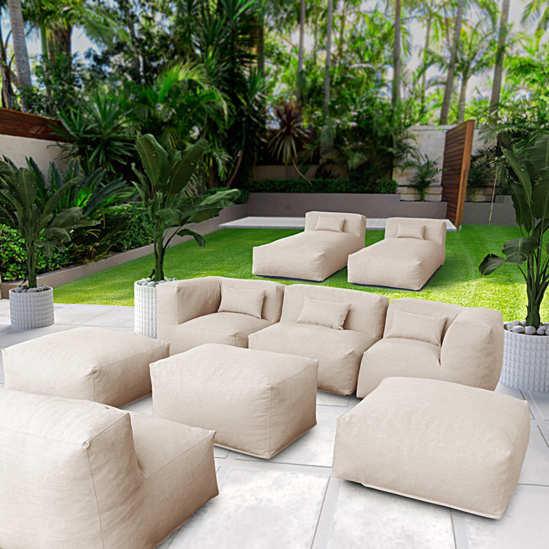Ensemble de mobilier de jardin modulaire de 9 pièces comprenant un pouf, une table basse rembourrée et un repose-pieds.