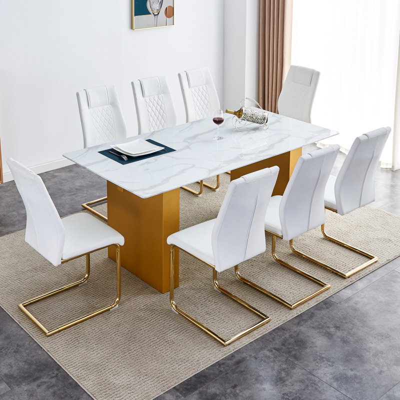 Ensemble de table et de chaises rectangulaire large avec plateau en verre à motif de pouces et grands pieds de table en bois aggloméré avec chaises avec sièges rembourrés en similicuir et pieds en métal