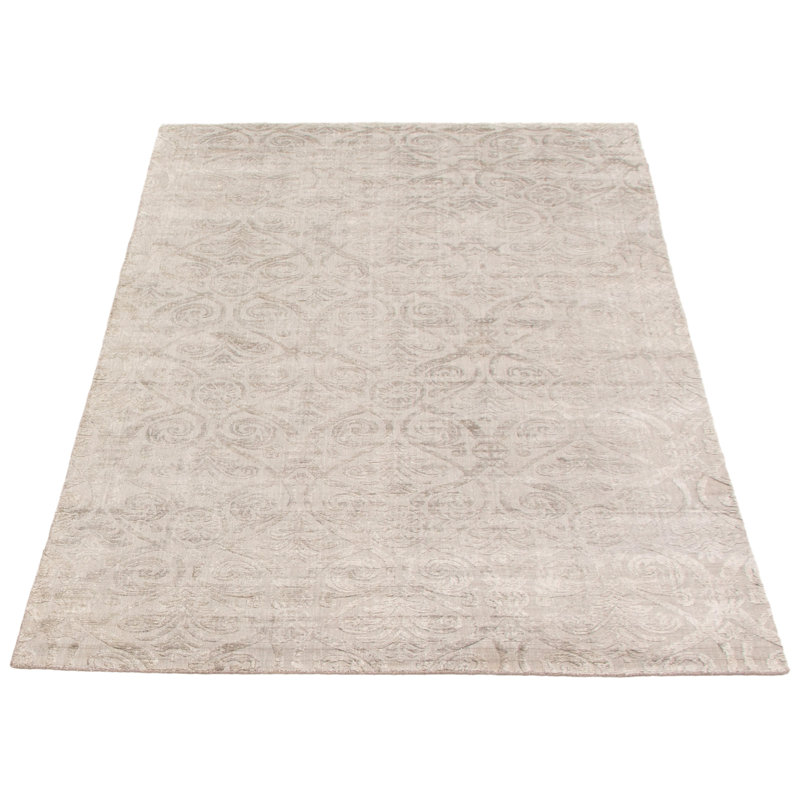 Tapis géométrique beige tissé à la main