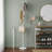 White Modern Steel Coat Rack With Cleverly Placed Wooden Hooks, Weighted Base For Stability, Easy To Assemble And Suitable For Entryways.