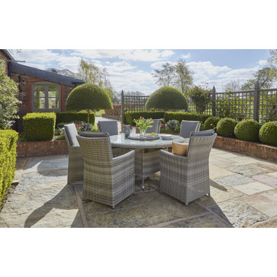 Burnham 6 - Person Wicker Patio Dining Set with Round Table , Cushions Included