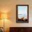 Art mural sur toile, tranche d'agrumes sur rebord de pierre surplombant le port-13381660