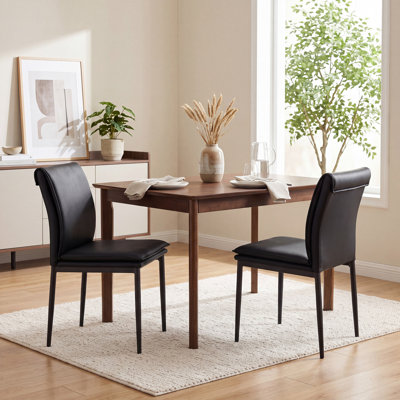Ensemble de 2 chaises de salle à manger rembourrées minimalistes, avec dossier en cascade, structure métallique robuste et sans accoudoirs.