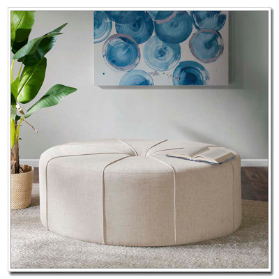 Repose-pieds capitonné ovale surdimensionné
