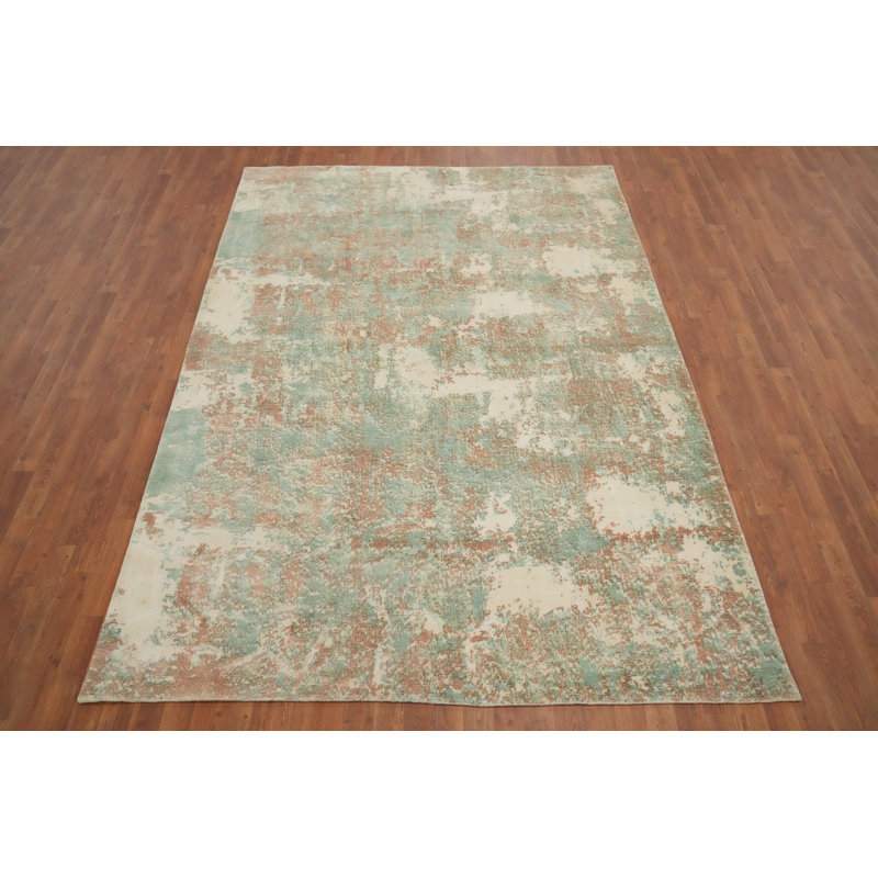 Tapis contemporain abstrait 7 x 9 avec des motifs et des teintes élégantes et douces