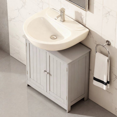 Meuble-lavabo peu encombrant gris clair avec tablette réglable pour rangement sous l'évier