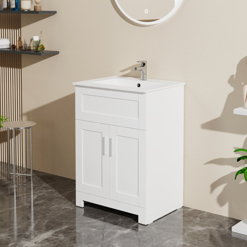 Meuble-lavabo blanc 24 po. Lavabo en céramique. Conception élégante avec amplement d'espace de rangement. Drain escamotable fourni. Blanc. Bassin. Capacité de rangement généreuse. Facile à assembler