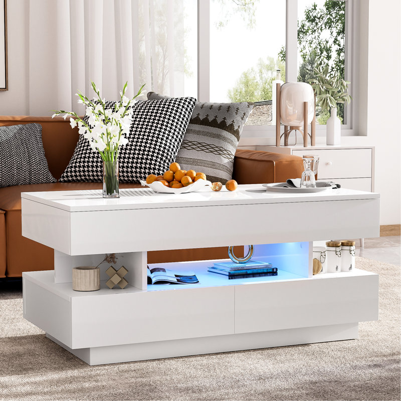 Table basse à plateau relevable ultrabrillant avec 2 tiroirs et 16 lumières à DEL de couleur, structure, beaucoup de rangement, matériau stable pour les tiroirs de salon, fonction d'éclairage, surface blanche, thème de décoration d'espace