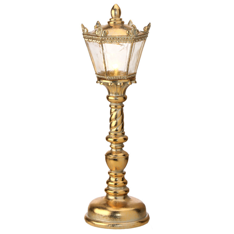 Lampe à pile dorée ornée