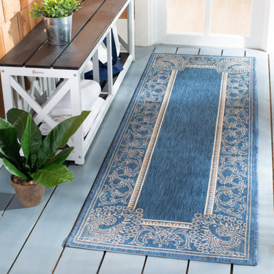 Tapis d'intérieur / extérieur bleu / naturel tissé à plat à la main Arneshia