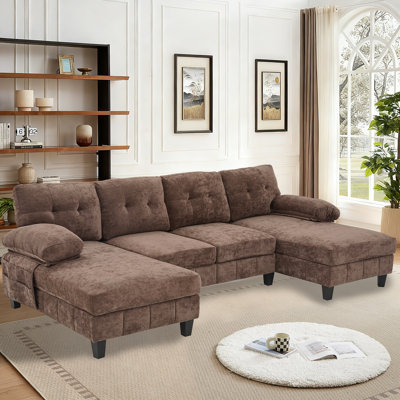 Large canapé en forme de U combiné avec deux fauteuils inclinables, des sacs de rangement et un dossier classique en suède.