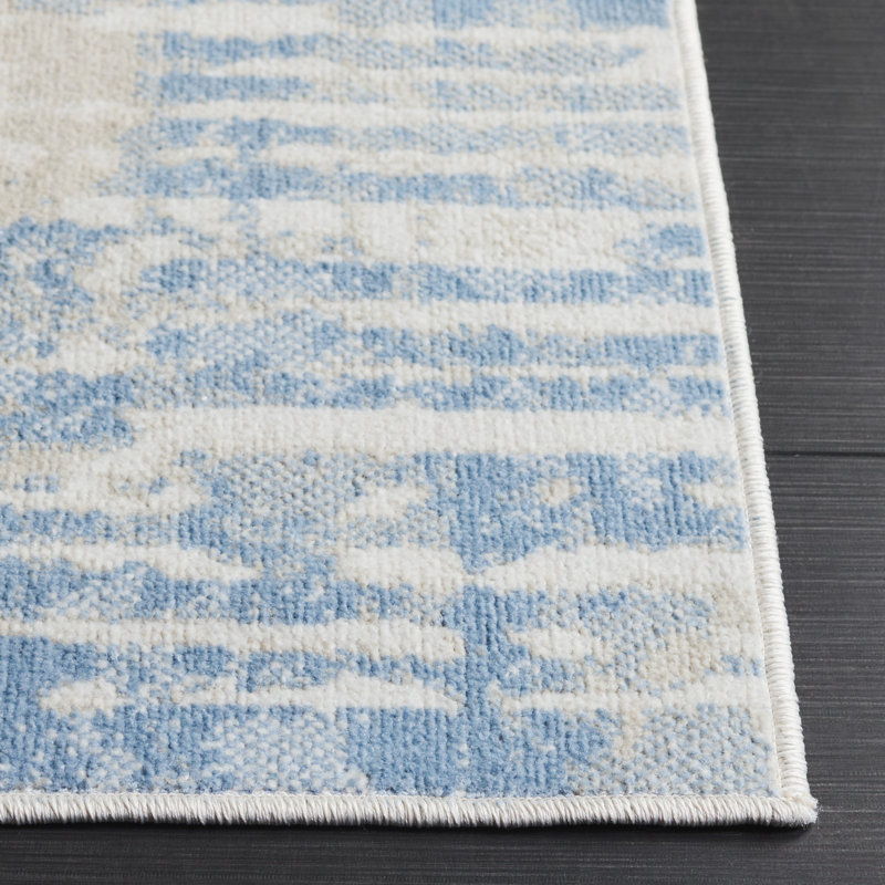 Ivory and Blue Abstract Synthetic Rectangular Area Rug