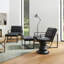 Fauteuil et repose-pieds en cuir Buren-90988295