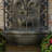 French Lily Polystone Outdoor Solar Wall Fountain with Battery Backup - Florentine Stone-1400205593