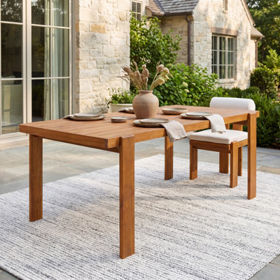 Sundra 67'' Modern Rustic Acacia Wood Outdoor Dining Table with Rectangular Top and Curved Leg Detail