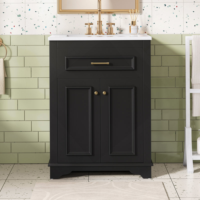 Meuble-lavabo de 24 pouces avec lavabo en céramique intégré, portes à fermeture en douceur et tiroir coulissant pour les toilettes modernes et compactes.