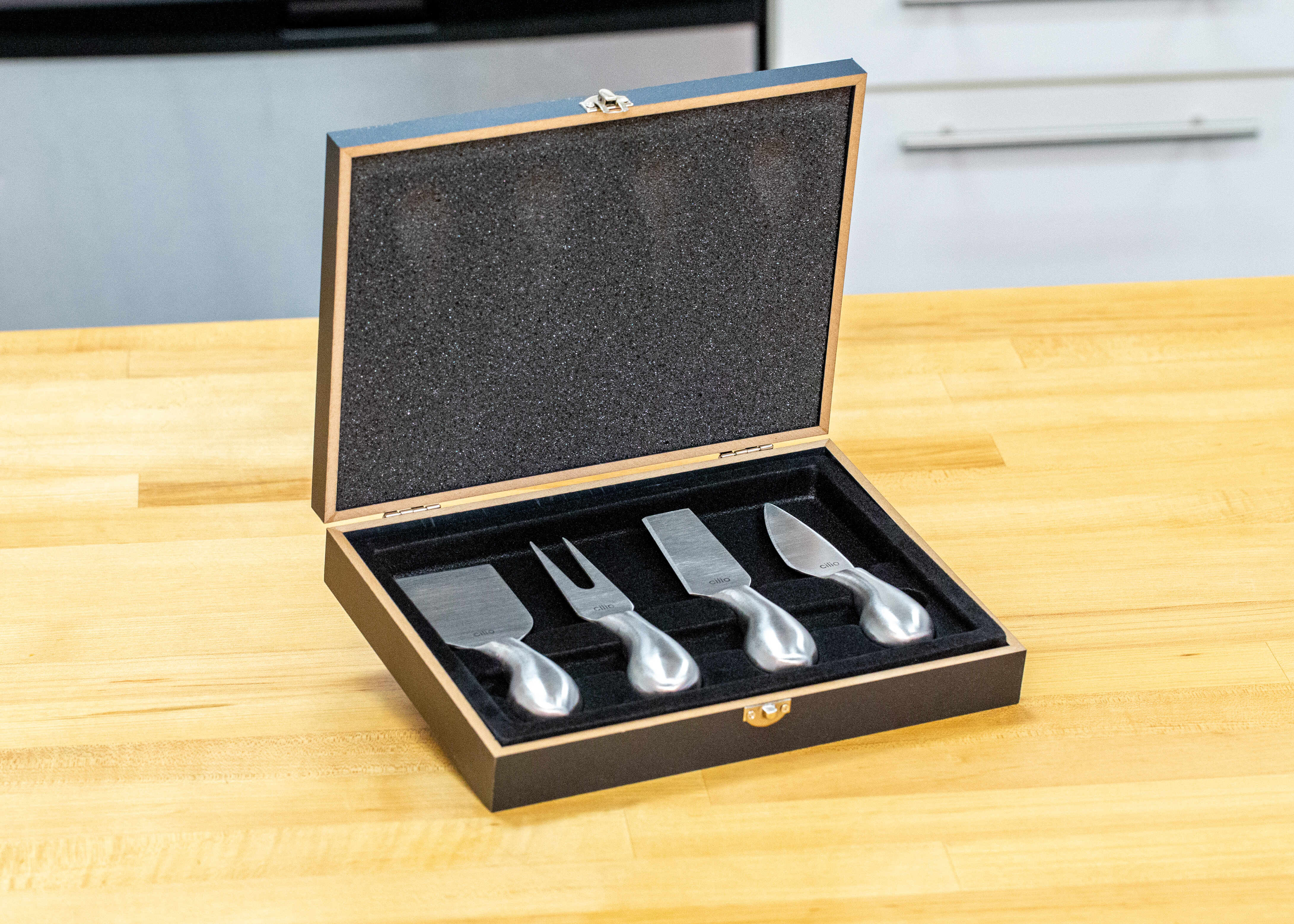 https://assets.wfcdn.com/im/56155763/compr-r85/1100/110013973/4-piece-stainless-steel-cheese-serving-set.jpg