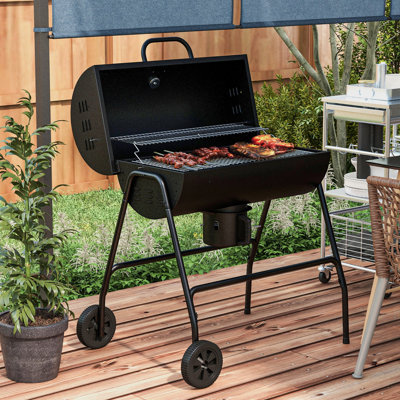 Barbecue au charbon de bois de 420 po² avec roues. Parfait pour la cuisine en plein air, les pique-niques sur la terrasse et les réunions dans la cour. Équipé d'un thermomètre intégré, d'un récupérateur de cendres et de roues.