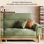 110.24"Green linen-blend loveseat with throw pillows