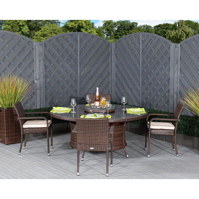 Ernst 4 - Person Patio Dining Set with Round Table , Cushions Included