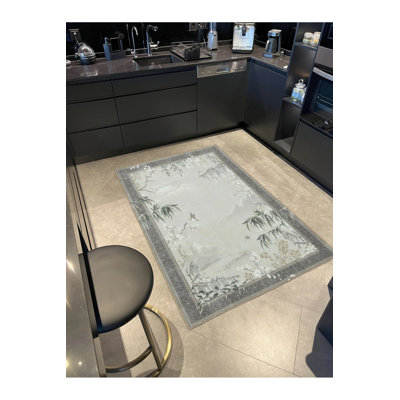 Tapis gris tissé lavable encadré