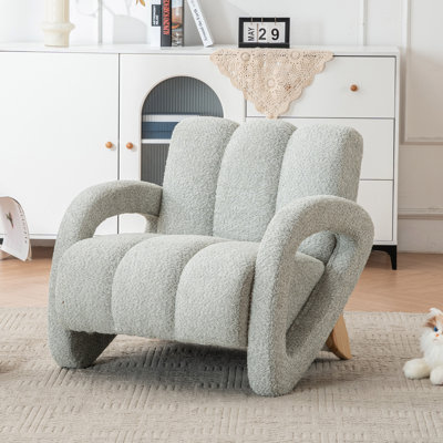 Fauteuil rembourré capitonné avec pieds en bois massif