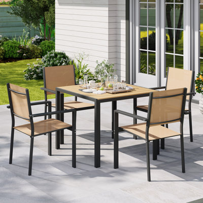 5 Piece Outdoor Patio Dining Set With 1 Square Patio Table & 4 PVC-coated polyester Stackable Chairs, Patio Dining Furniture For 4, Wpc Tabletop And All-weather Resistant Iron Frame, Suitable For Garden, Backyard And Deck, Brown