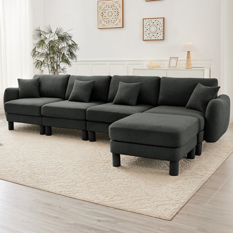 Canapé-lit modulaire convertible en forme de L à 4 places avec accoudoirs en forme de coquille distinctive, repose-pieds amovible et pieds cylindriques pour des espaces de vie polyvalents