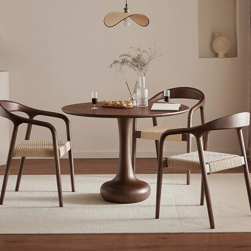 Table de salle à manger ronde en bois massif et en bois manufacturé de couleur noyer noir
