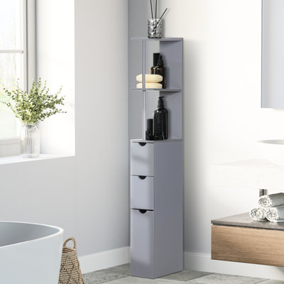 Meuble de salle de bain gris de 137 cm de haut. 2 tablettes ouvertes et tiroirs. Parfait pour les petites salles de bain. Structure robuste. Fixation murale possible pour plus de sécurité. Peut contenir des serviettes en lin. 15 cm L x 137 cm H. Assemblage requis.