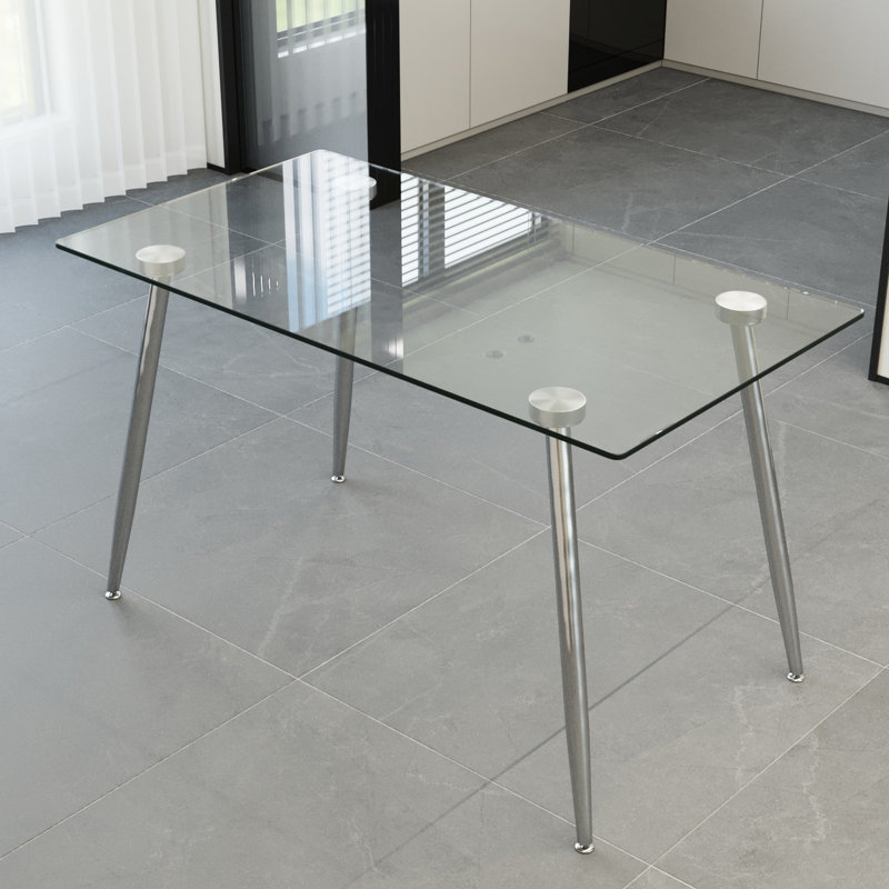 Élégante table de cuisine en verre avec une touche de sophistication moderne, de rayures polyvalentes pour différents styles de design, de protection des bords biseautés et d'esthétique