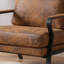 Fauteuil brun rembourré mi-moderne avec support en fer et siège épais pour espace de lecture