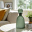 Glass Vase with Vertical Ribbed Detailing and Round Stopper Accent Aligned to Coastal Trend for Modern Decorative Display in Contemporary Interior Settings.-22520068-8510864