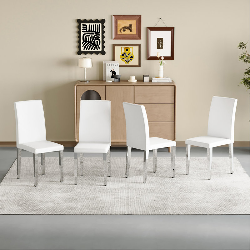 Set Of 2 Black PU Backrest Chairs With Silver Metal Legs: They Are Ideally Suited For Minimalist And Contemporary Home Styles, With Dimensions Of 