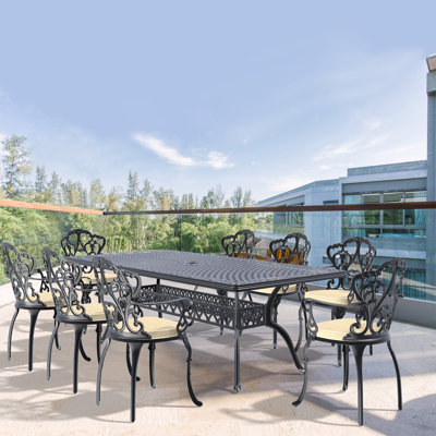 9-Piece Set Of Cast Aluminum Patio Furniture With Black Frame And Off-White Seat Cushions