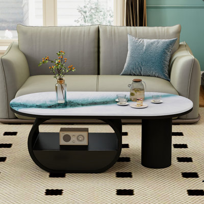 Table basse ovale contemporaine de 47,4 po avec plateau en pierre frittée brillante, base noire et tiroir pour le salon