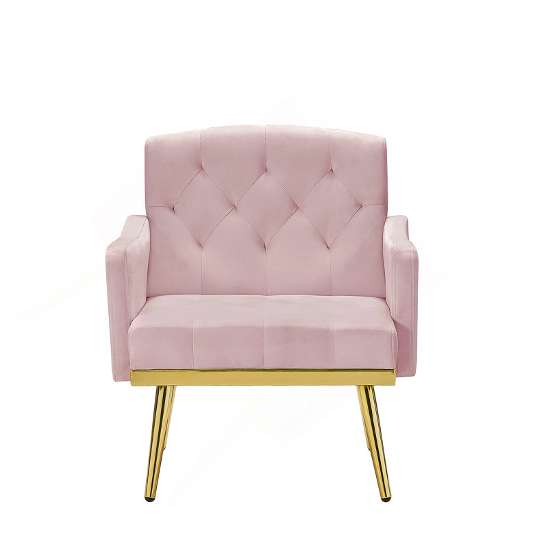 Fauteuil en velours confortable et élégant avec pieds en métal et poches latérales, idéal pour divers décors de maison