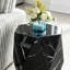 Table d'appoint moderne et minimaliste en marbre noir à motif.