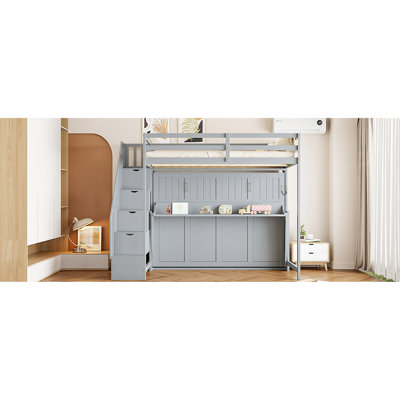 Lit double sur un lit gris avec mécanisme hydraulique avancé, espace de travail caché et armoires encastrées. Convient pour un espace de vie limité, un lit superposé pliable et un bureau. Une option pour économiser de l'espace