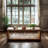 57" Wide Rectangular Mango Wood Coffee Table with Open Shelf in Natural Finish