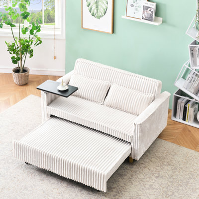 Confortable convertible en velours côtelé beige avec plateau de table mobile et, améliorant votre confort et votre table, pour travailler