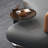 Simple round dark glass tea table