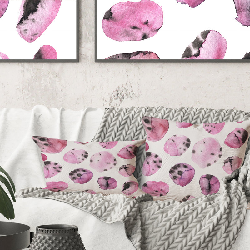 Coussin décoratif imprimé moderne rose et noir sur fond blanc