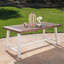 Table de salle à manger d'extérieur brun foncé en bois d'acacia à finition sablée avec structure en métal rustique blanc